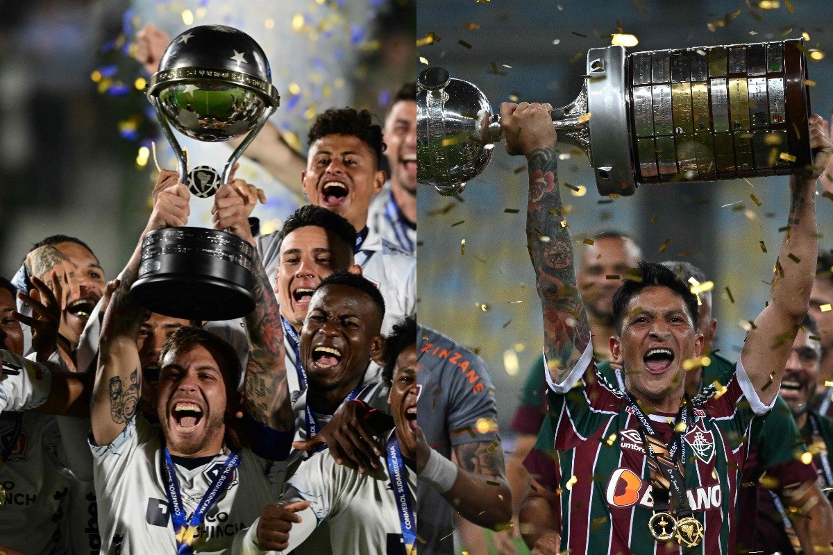 Jogadores de LDU e Fluminense levantando taças (foto: AFP)