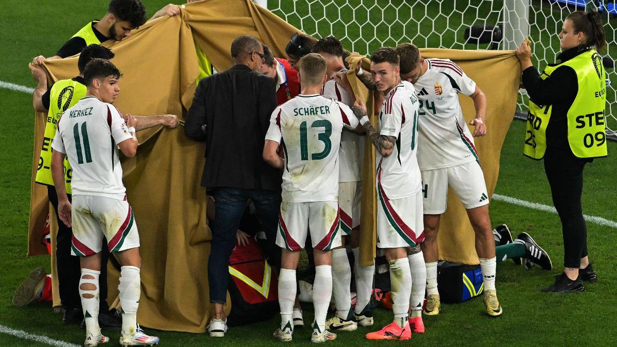 Momento em que Barnabás Varga recebe atendimento médico (foto: DAMIEN MEYER/AFP)