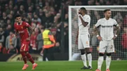 Jogadores do Liverpool comemorando gol pela Champions League (foto: Paul Ellis/AFP)