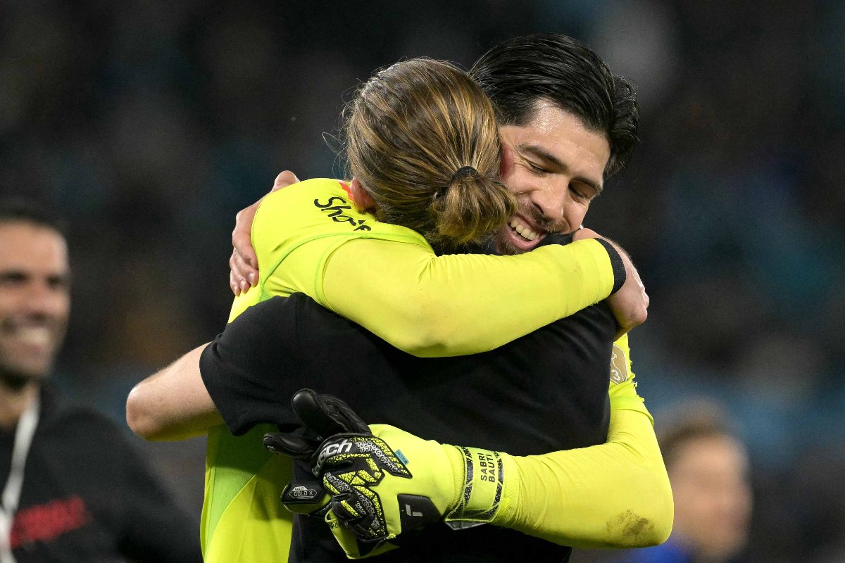 Filipe Luís e Rossi comemoram classificação do Flamengo à final da Libertadores (foto: JUAN MABROMATA/AFP)